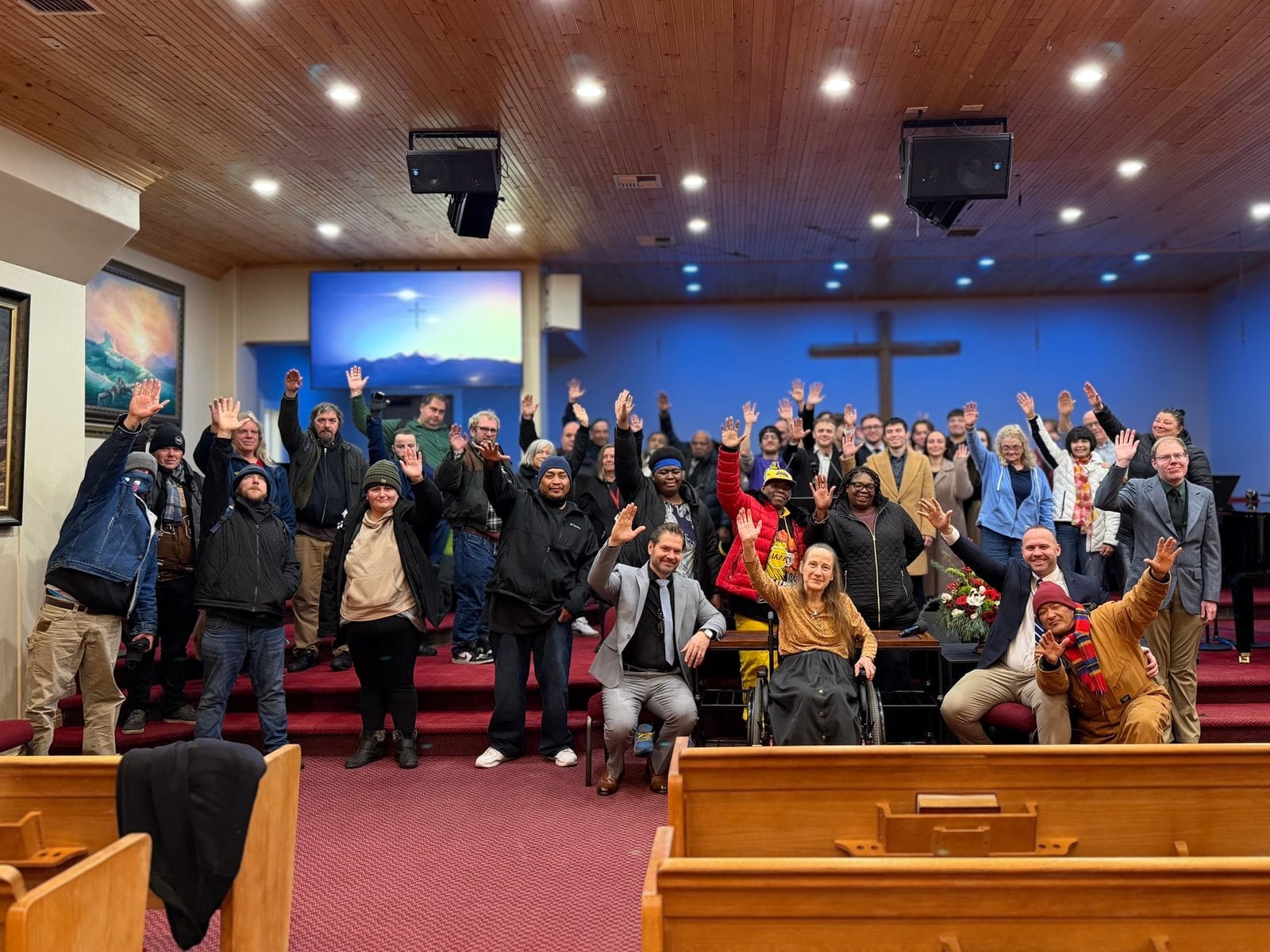 Morning Star Christian Church congregation in Boise on a Sunday morning, hands raised together during worship at our nondenominational service