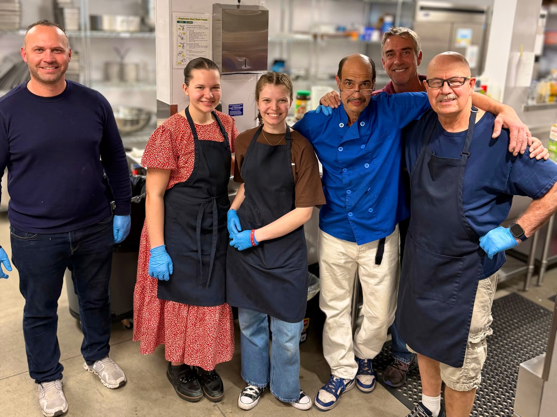 Morning Star Christian Church cooking ministry volunteer team gathered in the kitchen after preparing meals for Boise homeless shelters and the free Sunday community breakfast
